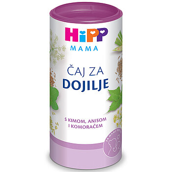 Cilindrična posuda s ljubičastim poklopcem, sa šarenim logotipom na vrhu, okružena raznim biljkama i sjemenkama, s tekstom na stranom jeziku.