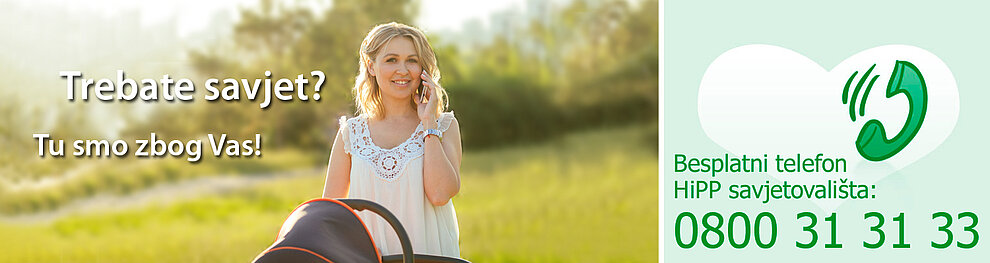 Žena u bijeloj haljini razgovara na mobitel, sa zelenim simbolom srca i telefonskim brojem s desne strane.