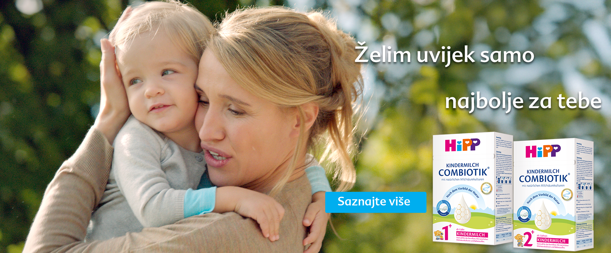 Žena s ljubavlju drži dijete, s desne strane tekst na stranom jeziku i dvije kutije dječjih proizvoda "HIpp".