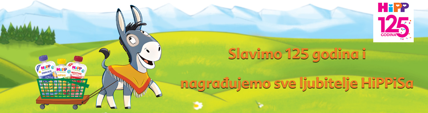 Magarac koji nosi kolica s proizvodima na zelenom polju s plavim nebom i planinama u pozadini.